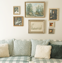 Framed vintage art on a gallery wall