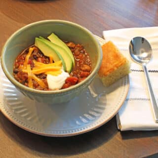 Bowl of chili on table
