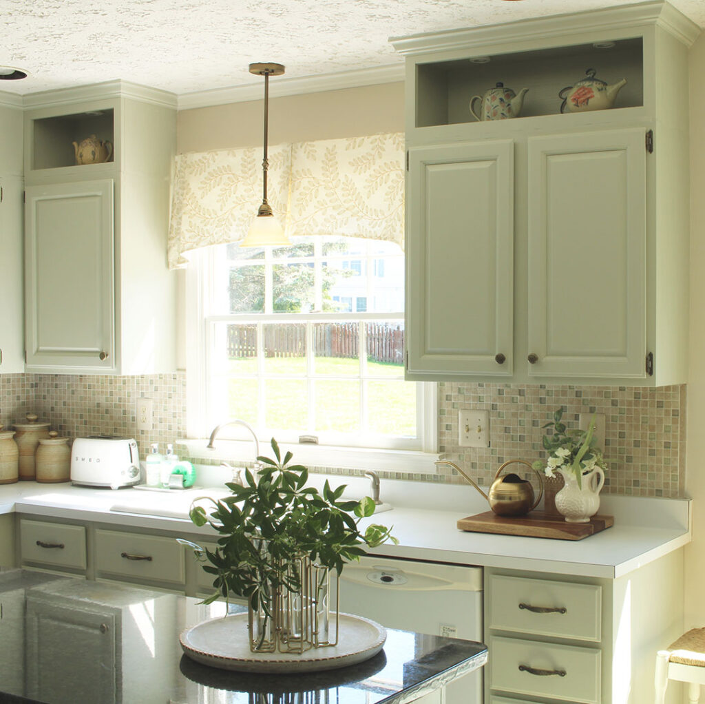 Painted kitchen cabinets with crown molding at top