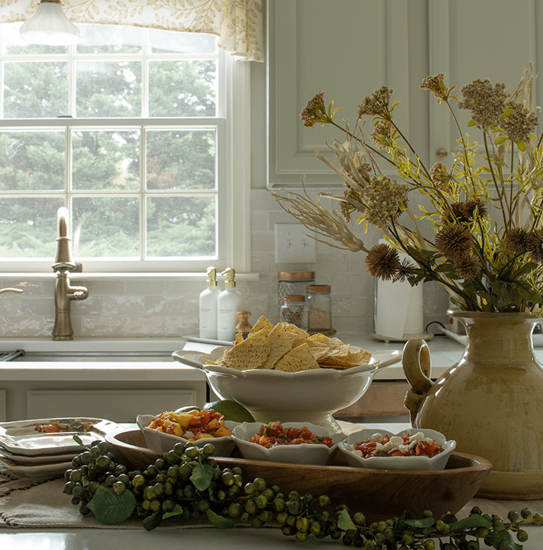 Peach, tomato and feta salsa in bowls on a kitchen island