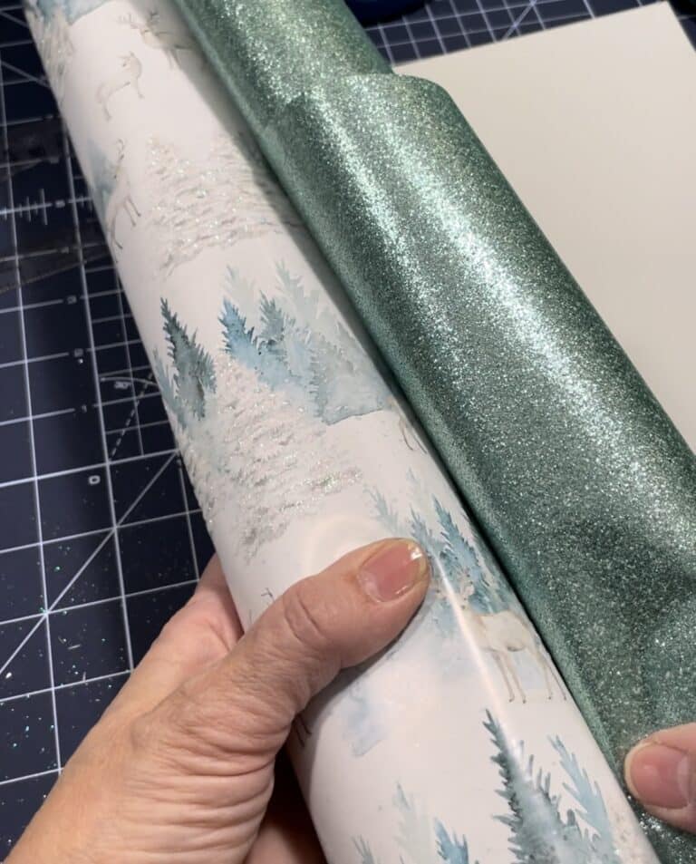 Two Christmas wrapping papers in shades of green that will be used for DIY gift tags.