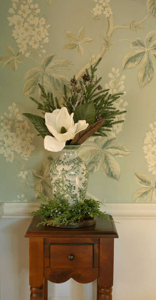 A vase holding cozy winter decor