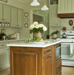 Kitchen island update with brown-tone stain and green surrounding cabinets