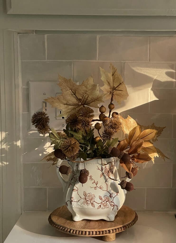 Brown transferware vessel filled with faux fall stems