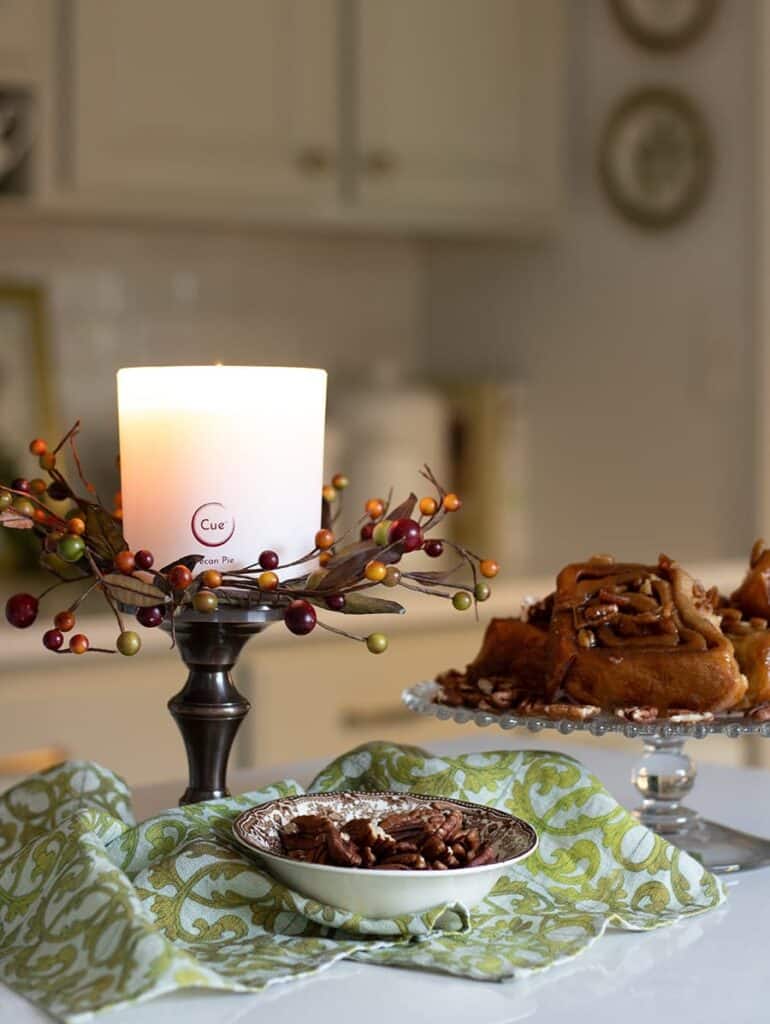 An example of styling a pecan pie scented candle on a candle stick.