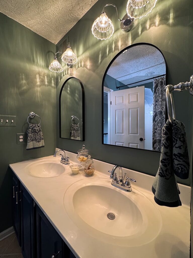 The after of a guest bathroom showing the area where a medicine cabinet was removed