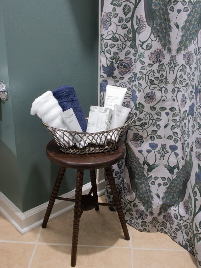 A bathroom stool topped with toiletries.
