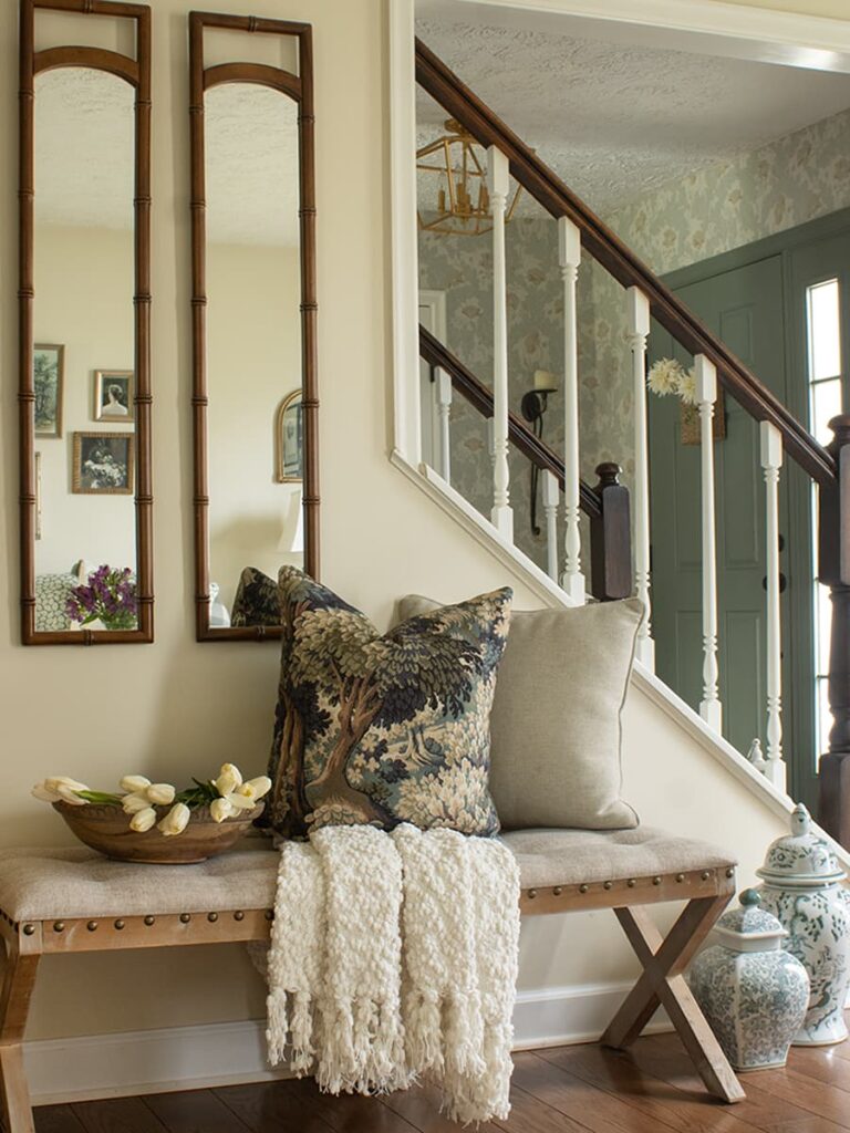 White tulips in a round bowl on a bench in a living room