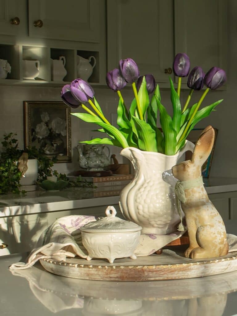 Purple tulips in a white ironstone pitcher styled on a kitchen island