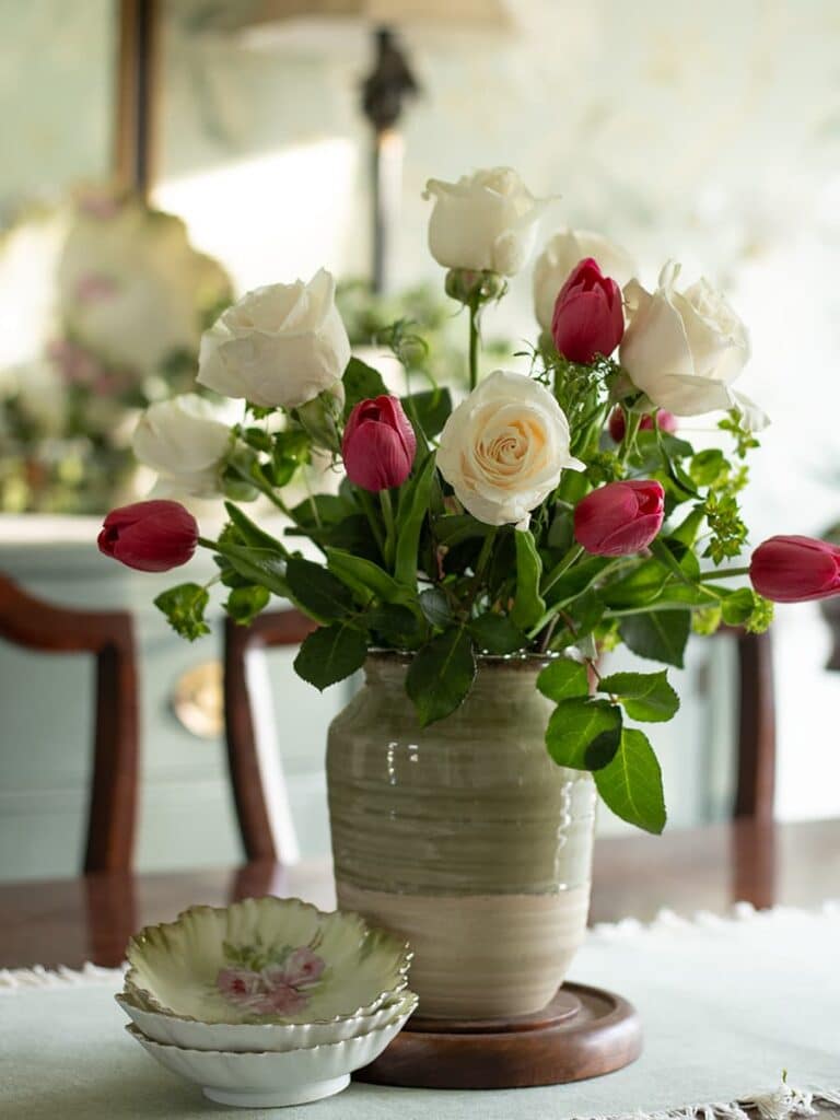 An example of adding faux tulips to a real floral arrangement
