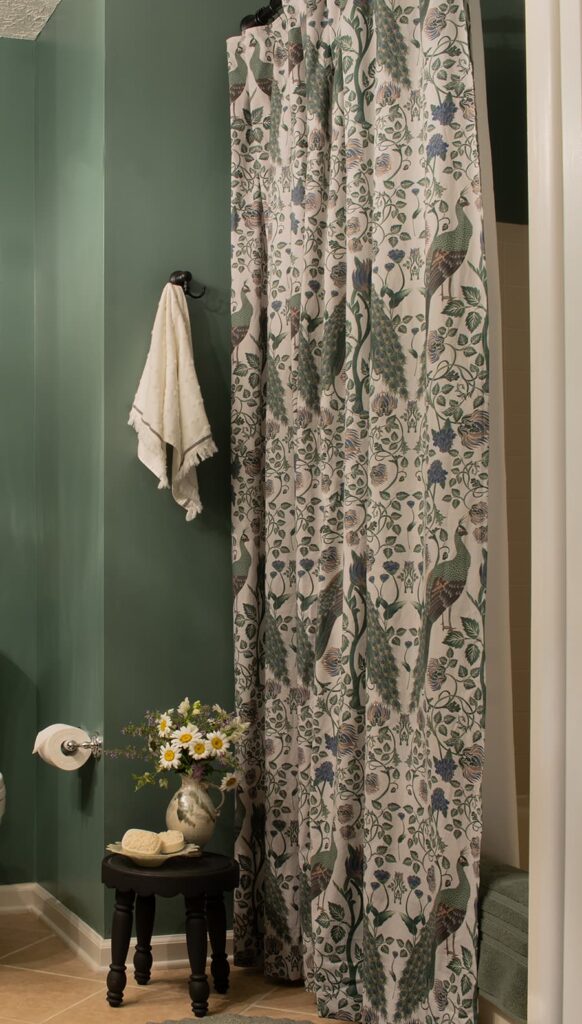 A bathroom showing a diy shower curtain