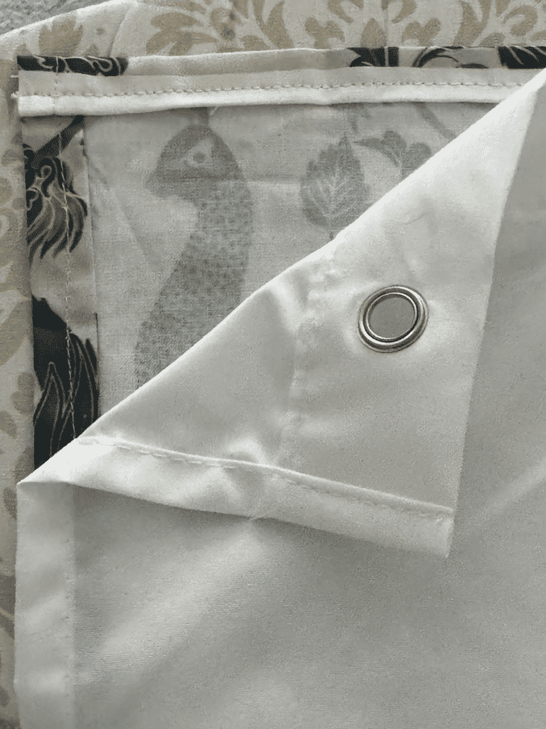 A shower curtain liner over a diy shower curtain to determine where to place rings