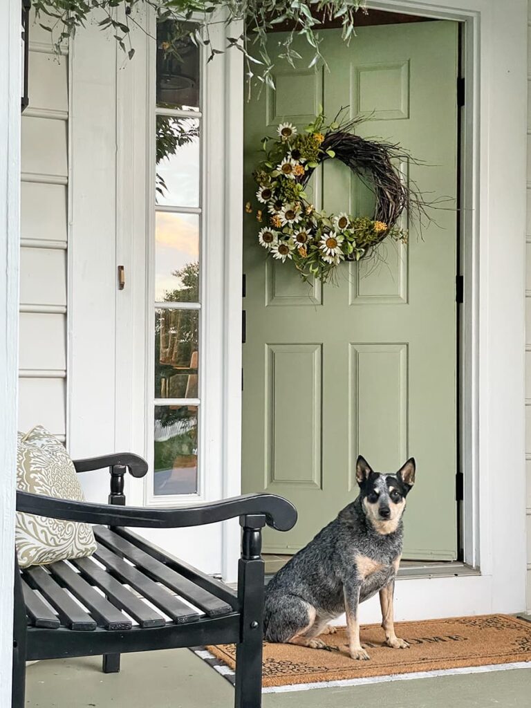 A front door painted Sherwin Williams Clery Sage