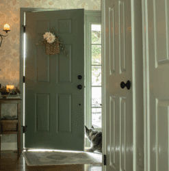 The interior side of a front door painted Sherwin Williams Retreat