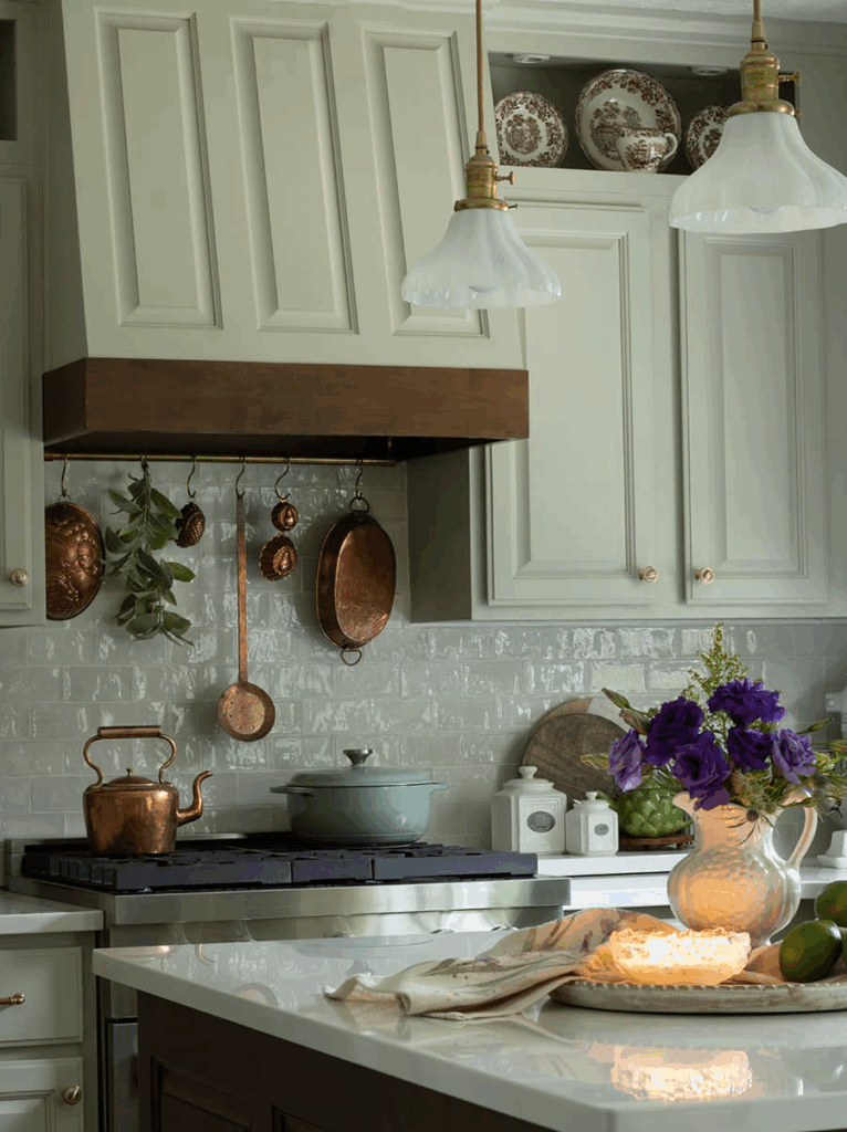An English country kitchen featuring milk glass pendant lights