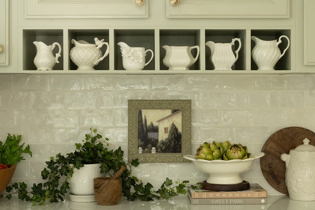 A white pitcher collection showcased in an English Country kitchen