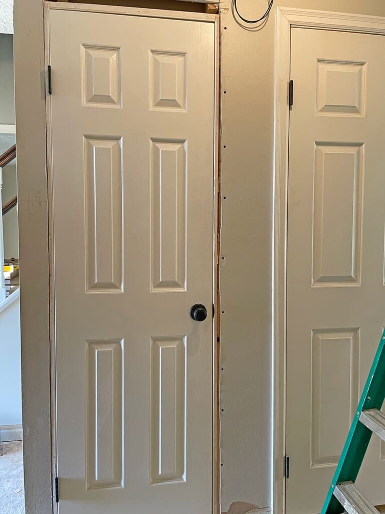 closet door that was moved from the foyer wall around the corner to the hallway.