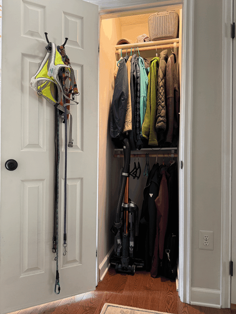 A coat closet that has been moved from the foyer to the hallway