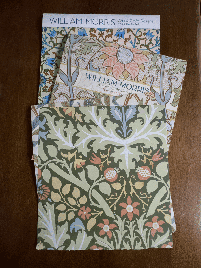 William Morris calendars on a table. The pages will be used to cover books.